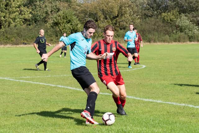 Burrfields (blue) in  Mid-Solent League action at Horndean in 2019/20. Picture: Duncan Shepherd