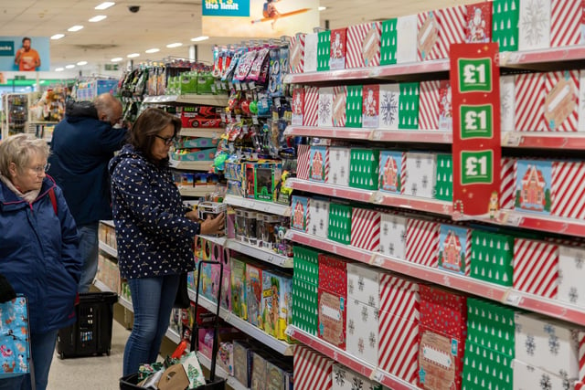 Customers browsing the seasonal items available in the newly located Poundland store in West Street, Fareham. Picture: Mike Cooter (091223)