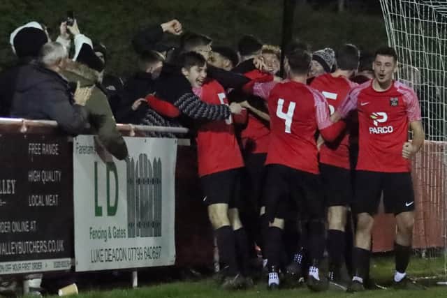 Fareham players and supporters celebrate their Portsmouth Senior Cup win. Picture by Ken Walker