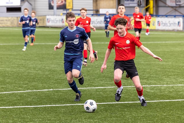 Action from the Under-14 Memorial Challenge Cup final between Pickwick Youth Pumas (all blue kit) and Horndean Youth Red. Picture: Mike Cooter