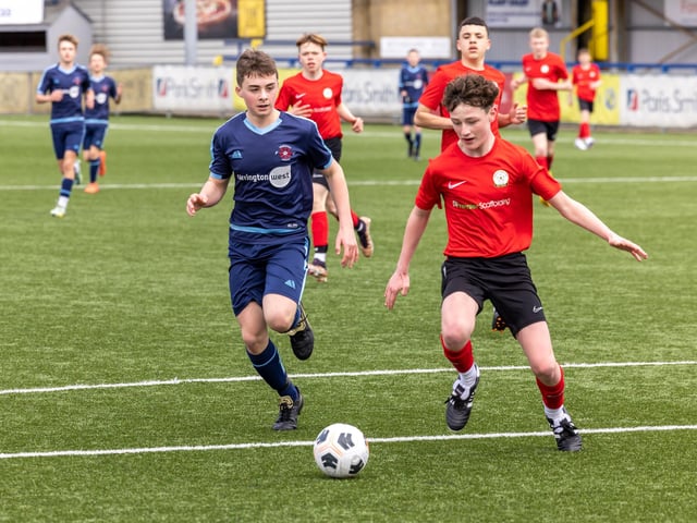 Action from the Under-14 Memorial Challenge Cup final between Pickwick Youth Pumas (all blue kit) and Horndean Youth Red. Picture: Mike Cooter
