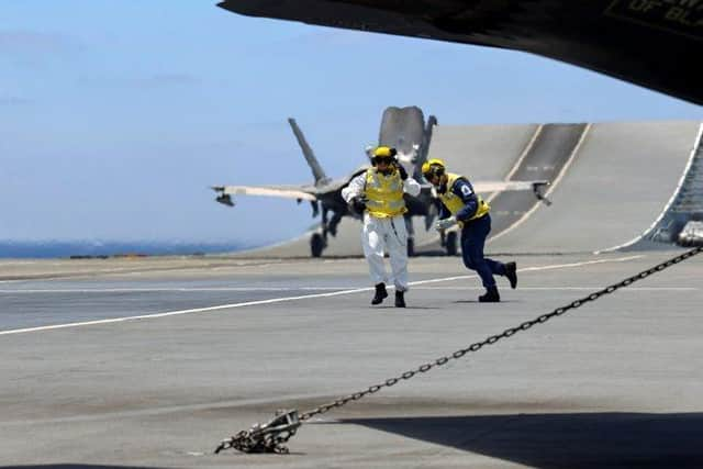 Lift off: the first RAF jet launches from HMS Queen Elizabeth on an operational mission targeting terrorists in Syria.