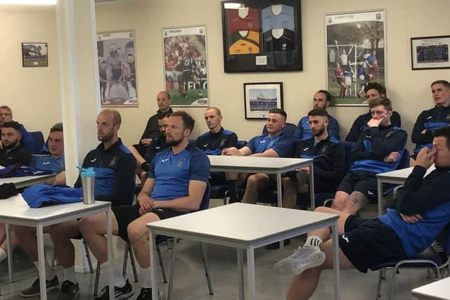 The US Portsmouth squad listen to boxer Mikey McKinson's inspirational talk