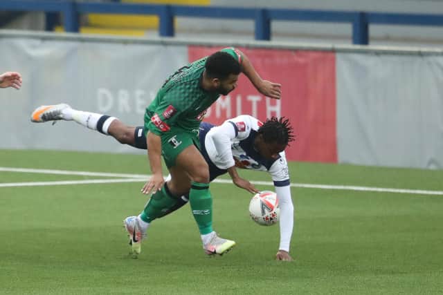 Lucas Sinclair goes down after a challenge by Kalvin Morath-Gibbs, but no penalty was awarded. Photo by Dave Haines