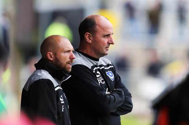 Ian Foster (left) and Paul Cook haven't spoken since first-team coach Foster quit Fratton Park to take up a prized role with England. Picture: Joe Pepler