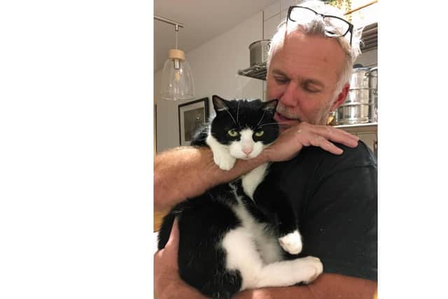 Martin Kingston reunited with his cat Boo. Picture: Cats Protection Gosport