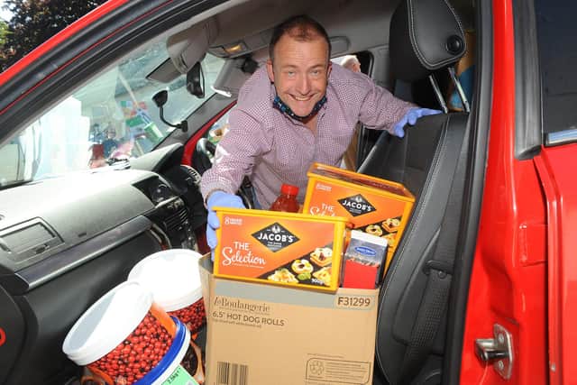 Mill Rythe Holiday Village in Hayling Island have donated thousands of pounds worth of food to The LifeHouse in Albert Road, Southsea. 

Pictured is: Mike Morell, manager and chair of trustees at The Lifehouse, packs up his car with the donated food.

Picture: Sarah Standing (210720-1561)