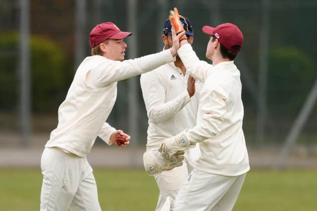 University of Portsmouth players, including wicket-keeper Harry Reed, celebrate the dismissal of Charlie Whitfield. Picture: Keith Woodland