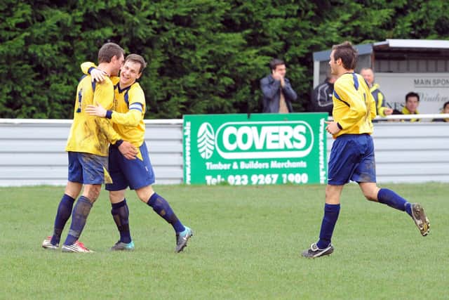 Steve Hutchings, left, is congratulated by Russ Rackley after scoring one of his hat-trick goals against Horndean on Boxing Day, 2011. Picture: Malcolm Wells