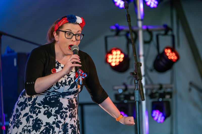 Debbie C leads a lunchtime singalong with visitors to the Lee Victory Festival.