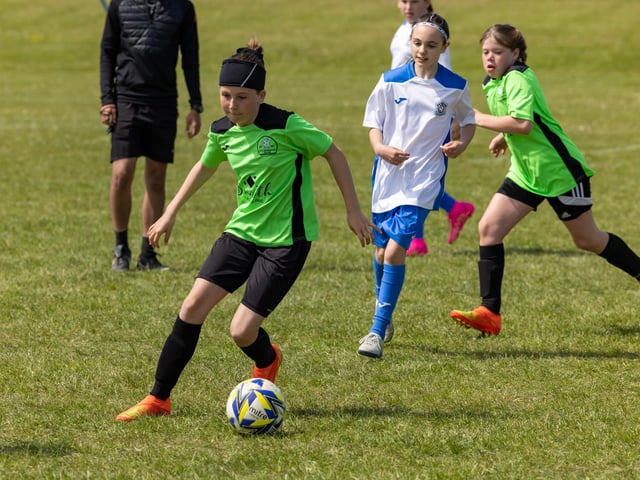 Bedhampton Eagles U11s (green kit) up against Downgrange Wildcats (white kit) in the Clanfield youth football tournament at Horndean Technology College. Picture: Mike Cooter
