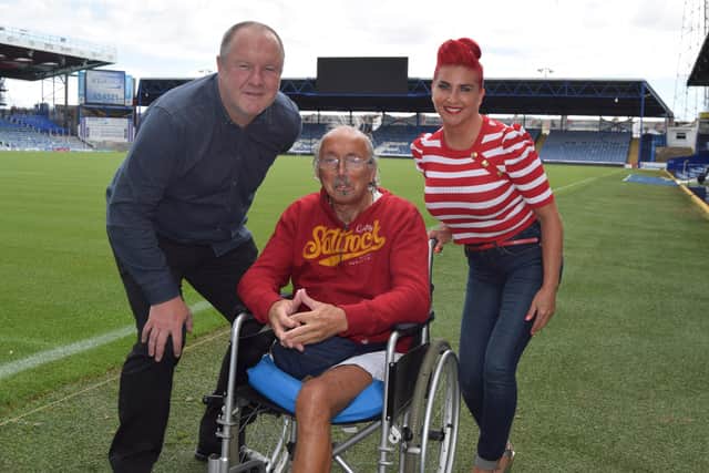 Lucky winner Barry Gibbs, centre, pictured with Gill Harris of the Football Pools, and former Pompey player Guy Butters. Photo: Tom Cotterill
