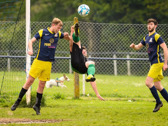 Action from Saturn Royale's 1-0 win over Pelham Arms (blue and yellow kit) in the second Adelaide Cup semi-final. Picture: Keith Woodland (300421-93)