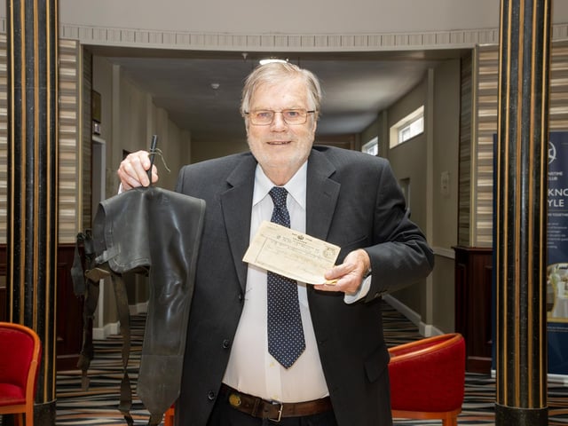 Pictured - Graham Holloway, son of Oscar Holloway who was an Able Seaman on HMS Kipling, with his father's telegram to his mother a few days after the sinking and his father's original life jacket worn during the attack.