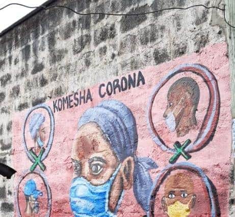 A mural showing how to correctly wear a face mask.