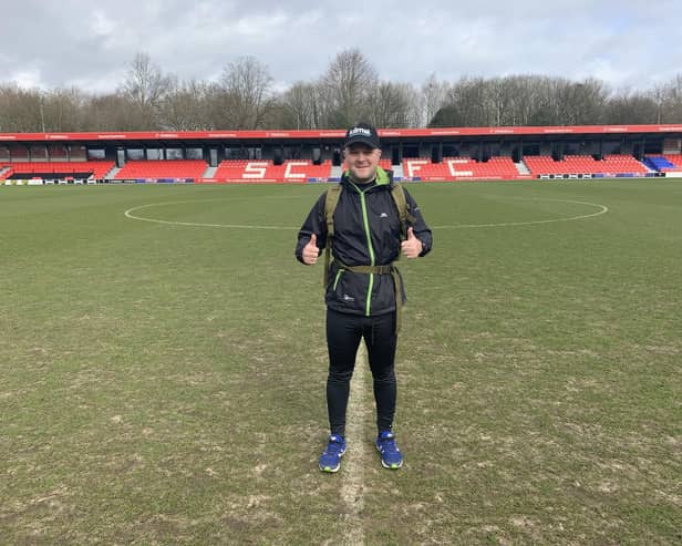 Nathan Richardson is running to all 92 stadiums in the top four tiers of English football, and will soon make his way to Fratton Park. Pictured here at Salford City FC