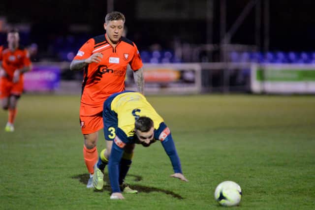 Moneyfields goalscorer Josh Hazell with Portchester's Jake Raine. Picture: Martyn White