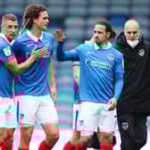 Lee Brown, Rasmus Nicolaisen and Ryan Williams celebrate the win over MK Dons. Picture: Joe Pepler