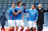 Lee Brown, Rasmus Nicolaisen and Ryan Williams celebrate the win over MK Dons. Picture: Joe Pepler