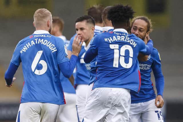Pompey celebrate Marcus Harness' second goal at Burton. Picture: Daniel Chesterton/phcimages.com