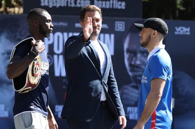 Matchroom Boxing promoter Eddie Hearn, centre, gets his arm in the middle of a fiery face-off between Mikey McKinson, right, and Chris Kongo prior to their meeting last March. Picture: Mark Robinson/Matchroom Boxing