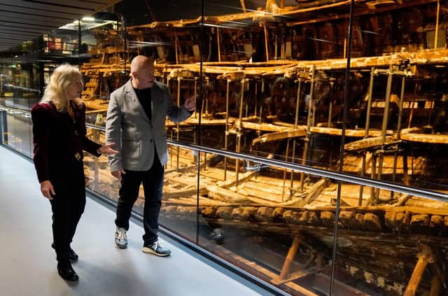 Dr Alex Hildred, Head of Research and Curator of Ordnance and Human Remains at The Mary Rose Trust and Ross Kemp walk past the Mary Rose during the launch of the immersive 4D cinema attraction Dive the Mary Rose 4D at the Mary Rose Museum.
Picture: Andrew Matthews/PA Wire