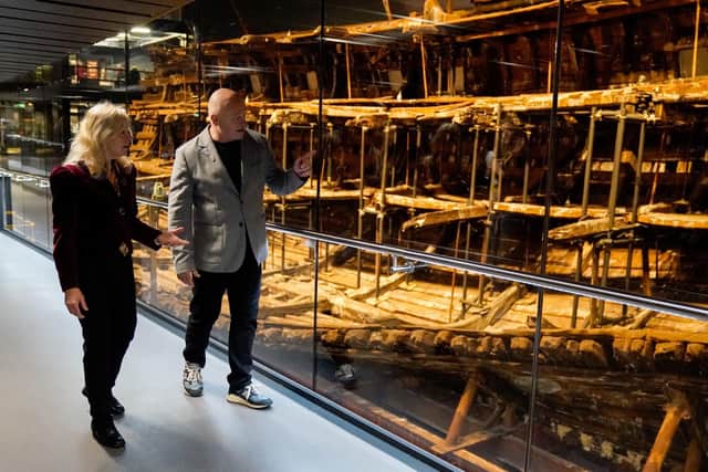 Dr Alex Hildred, Head of Research and Curator of Ordnance and Human Remains at The Mary Rose Trust and Ross Kemp walk past the Mary Rose during the launch of the immersive 4D cinema attraction Dive the Mary Rose 4D at the Mary Rose Museum.

Picture: Andrew Matthews/PA Wire