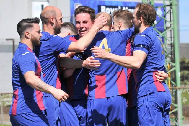 Tom Jeffes (second left) is among the US Portsmouth players celebrating with James Franklyn after he had put them ahead in the FA Vase tie with Christchurch. Picture: Martyn White.
