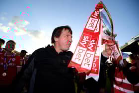 BRISTOL, ENGLAND - MAY 04: Daniel Stendel, Manager of Barnsley celebrates with trophy as his team are promoted following their restul in the Sky Bet League One match between Bristol Rovers and Barnsley at Memorial Stadium on May 04, 2019 in Bristol, United Kingdom. (Photo by Harry Trump/Getty Images)
