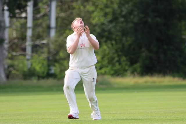 Bournemouth fielder Robbie Pack about to catch Havant's Richard Jerry. Picture: James Robinson