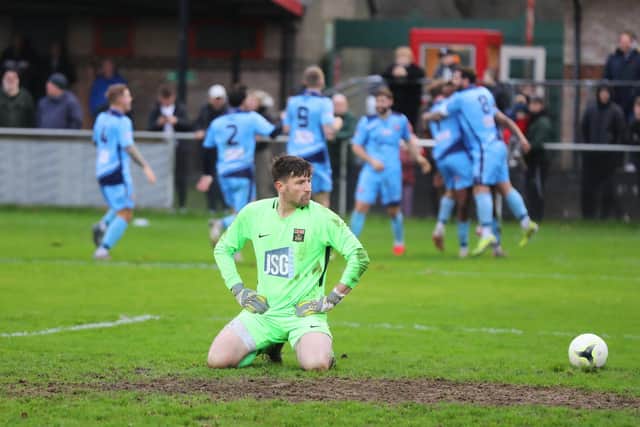 Fareham Town debutant goalkeeper Henry Woodcock falls to his knees after conceding a goal. Picture: Sam Stephenson