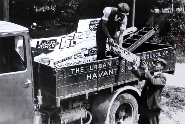 Road signs being removed in Cosham so any German invaders would not know where they were. Picture: Mike Beel collection