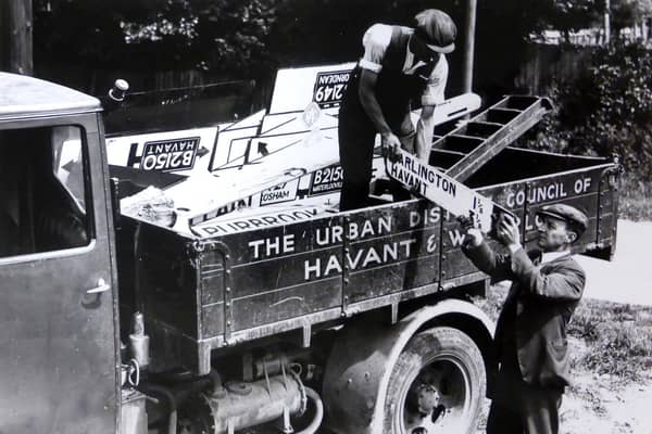 Road signs being removed in Cosham so any German invaders would not know where they were. Picture: Mike Beel collection