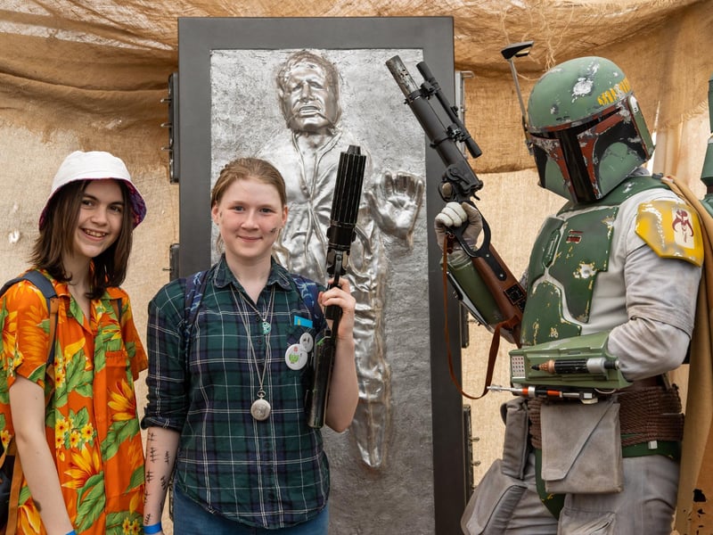 Bea, 14 and Wyn, 13 posing with Boba Fett