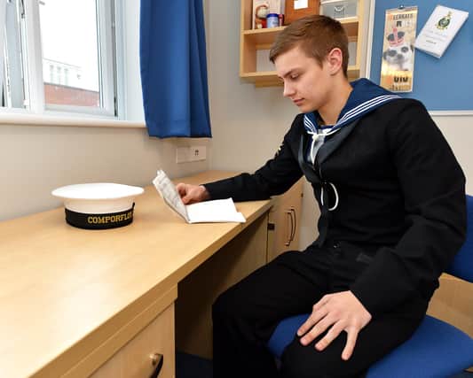 Pictured: Image shows Able Seaman Connor Berry in the en-suite cabins in the junior rates accommodation, Falklands Block at HMS Nelson, HMNB Portsmouth, when it opened in February 2015.
Picture: LA(Phot) Dan Rosenbaum
