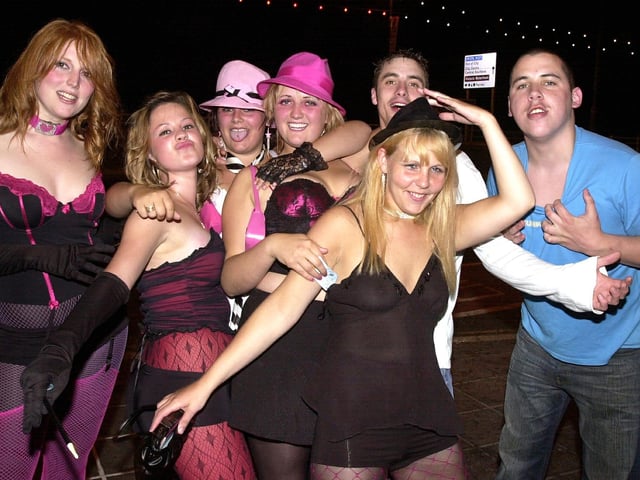 Clubbers having a good time arriving outside Time & Envy nightclub at South Parade, Southsea in the 00s.