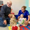 Solent Lodge members Alwyn Parsons (left) and Roger Macriner with nurse Jo Foley and patients Wyatt, nine months, and Rose, six months.