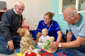 Solent Lodge members Alwyn Parsons (left) and Roger Macriner with nurse Jo Foley and patients Wyatt, nine months, and Rose, six months.