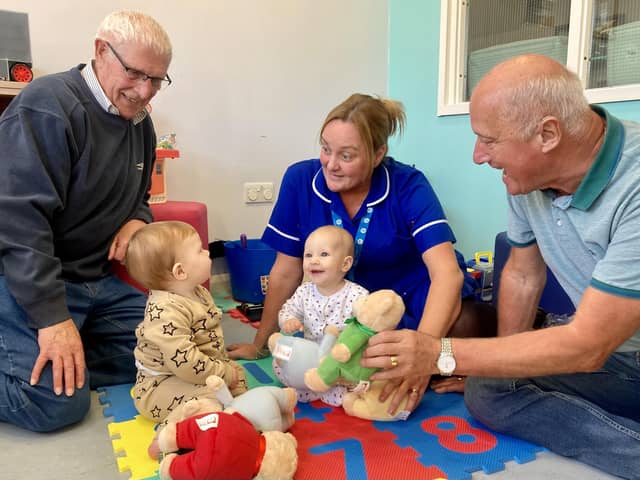 Solent Lodge members Alwyn Parsons (left) and Roger Macriner with nurse Jo Foley and patients Wyatt, nine months, and Rose, six months.