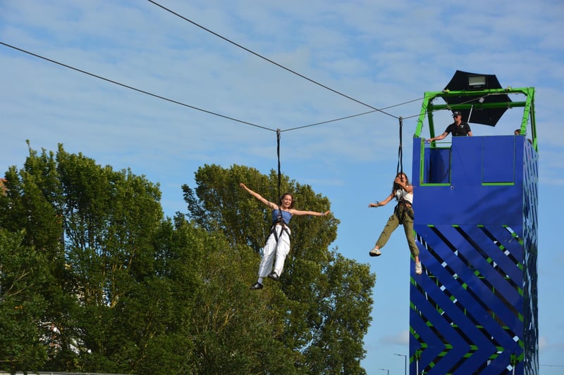 People enjoy a zip line at the Victorious Festival in Southsea, Hampshire. Picture date: Friday August 25, 2023. PA Photo. See PA story SHOWBIZ Victorious. Pic: Ben Mitchell/PA Wire