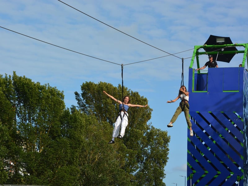 People enjoy a zip line at the Victorious Festival in Southsea, Hampshire. Picture date: Friday August 25, 2023. PA Photo. See PA story SHOWBIZ Victorious. Pic: Ben Mitchell/PA Wire