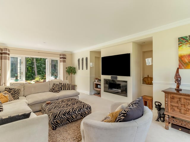 The lounge is both spacious and bright, and boasts an attractive feature fireplace at its heart, with bi-folding doors leading out to the rear garden.