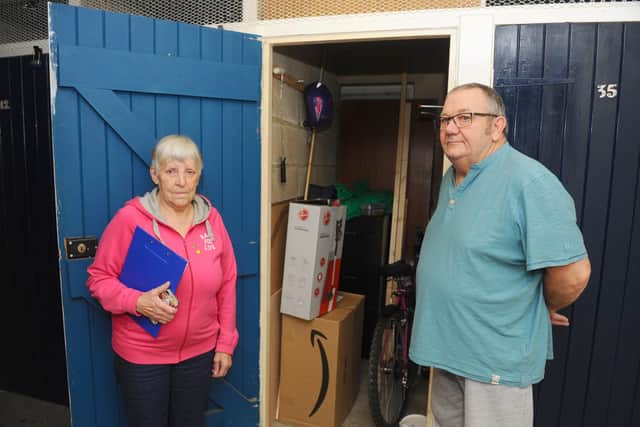 Residents at Guinness flats in West Leigh are angry as the housing association is taking away their storage sheds to provide a sprinkler system and not providing an alternative storage facilty.Pictured is: Jenny Wright (72) with her husband Mike Wright (76) with their shed.Picture: Sarah Standing (301020-7301)