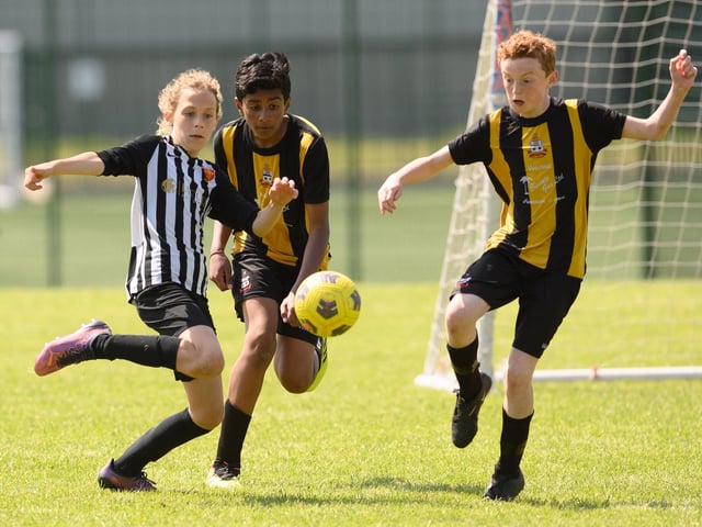 Action from the Clanfield youth football tournament at Horndean Technology College. Picture: Keith Woodland (270521-497)