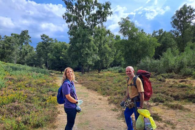 South Downs National Park Authority of Olivia French engagement officer for Heathlands Reunited and charity hiker Henry Rawlings on the Serpent Trail. Picture: Jeff Travis/PA.