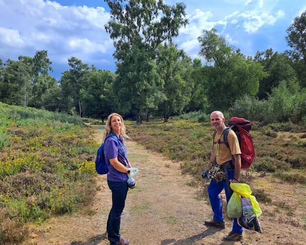 South Downs National Park Authority of Olivia French engagement officer for Heathlands Reunited and charity hiker Henry Rawlings on the Serpent Trail. Picture: Jeff Travis/PA.