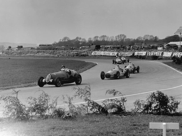 15th May 1951:  D Poore in an Alfa (25), leading B Bira (1914 - 1985) in an Osca (5) and G Farina in a Maserati (3) at Woodcote Corner during the Festival of Britain race, Goodwood.  (Photo by Fisher/Central Press/Getty Images)