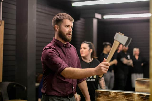 Pictured: Reporter Joe Buncle having a go at throwing an axe.

Picture: Habibur Rahman