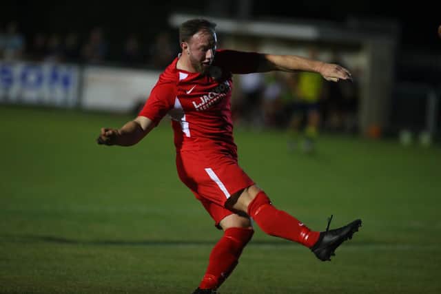 Horndean's Connor Duffin scores his opening goal against Moneyfields. Picture Stuart Martin