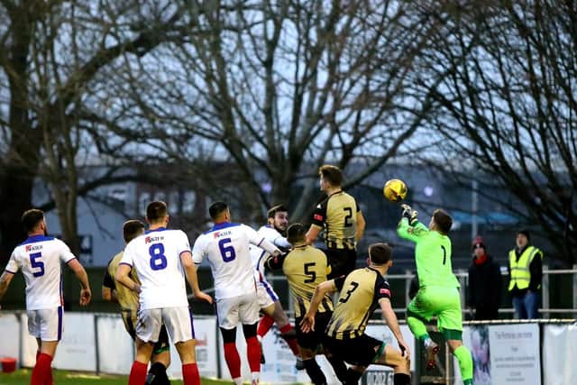 Poole keeper Mark Childs about to divert a Harry Kavanagh corner into his own net. Picture: Tom Phillips